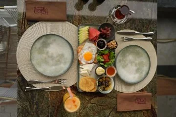 A table set with breakfast dishes at Fiaba Brasserie