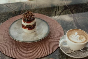 A layered dessert at a window table at Fiaba Brasserie