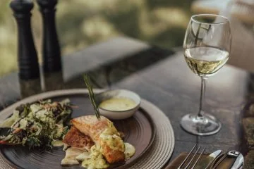 A plated meal at a window table at Fiaba Brasserie