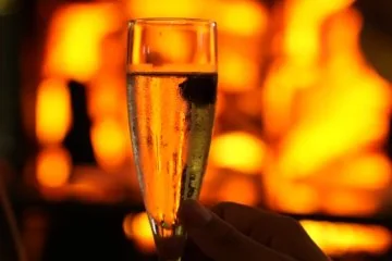 A drink beside the fireplace at Fiaba Brasserie