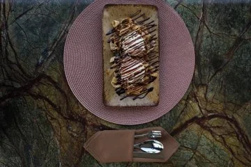 A chocolate dessert on a pink plate at Fiaba Brasserie
