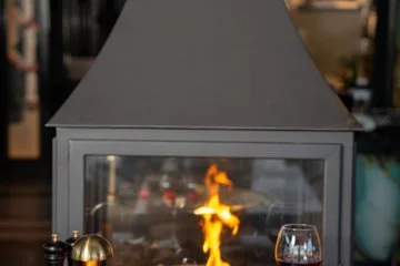 Food and drinks served beside the fireplace at Fiaba Brasserie